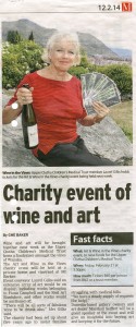 Wanaka Sun story on the Trust's 2014 Art and Wine in the Vines fundraiser, showing Laurel Gilks with some of the donated wine and tickets