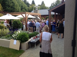 The guests at the Trust's 2014 Art & Wine in the Vines enjoying some wine and food in the sun 